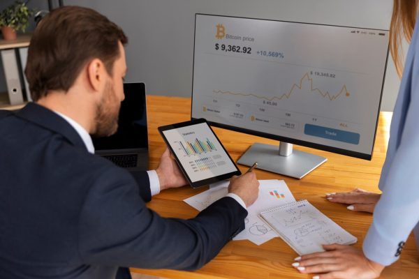 business-person-looking-finance-graphs_23-2150461357 Trusted Canadian factoring company helping businesses grow